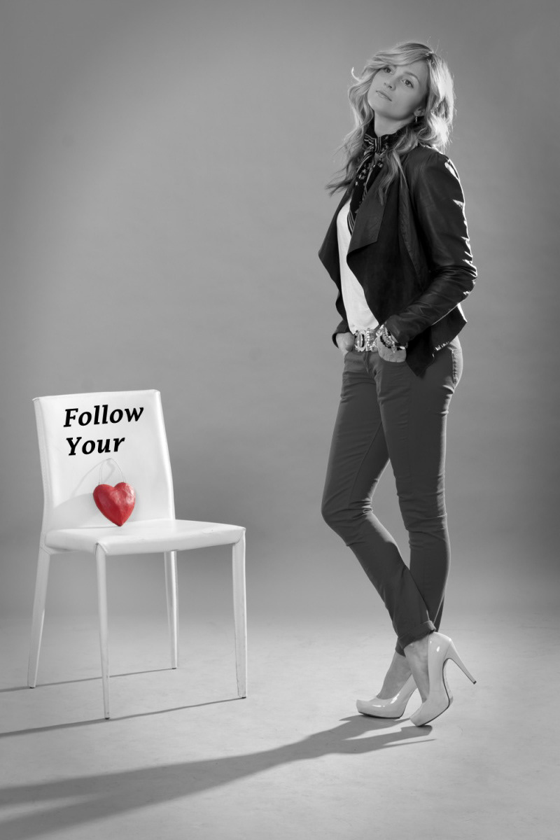 Rebecca Poole standing by a red heart