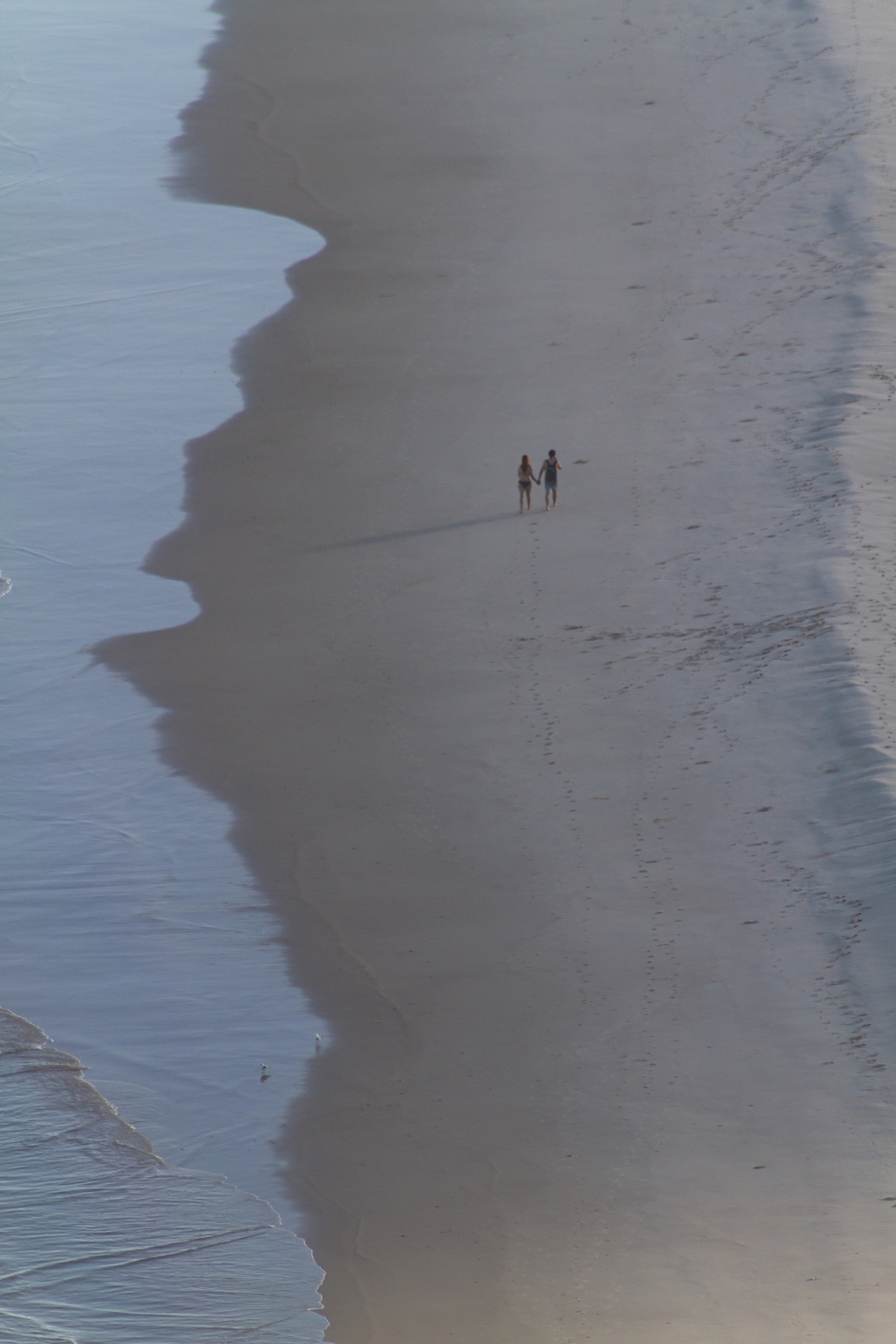 Couple alone in beach in Byron Bay